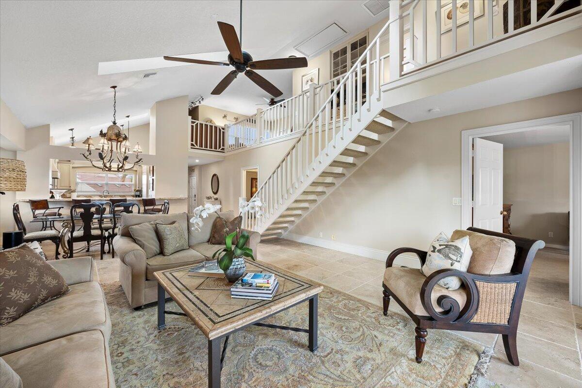 4161 U.S. Highway 1, Unit N3 Jupiter, FL 33477 - Photo 12 of 43 a living room with furniture a rug and white walls