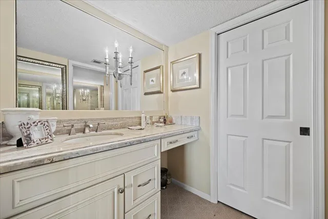a bathroom with a granite countertop sink mirror and double