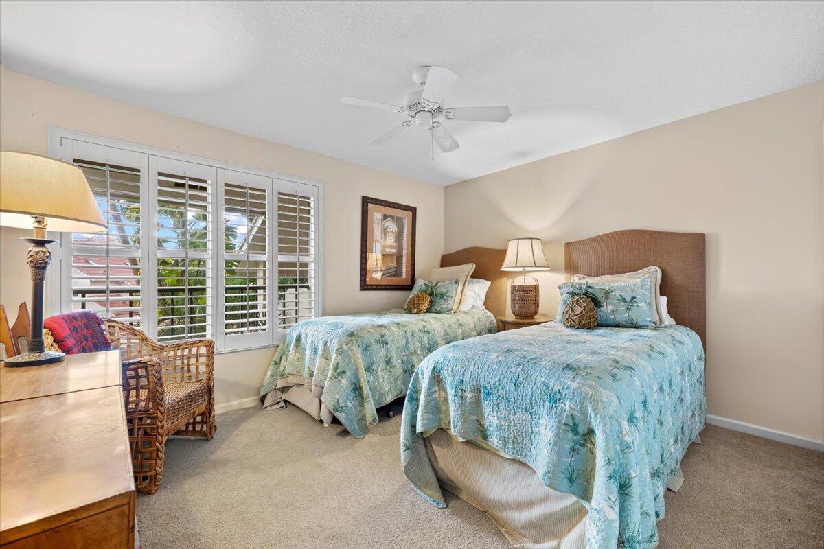 4161 U.S. Highway 1, Unit N3 Jupiter, FL 33477 - Photo 19 of 43 a spacious bedroom with two beds and a large window