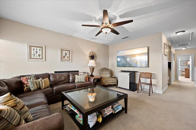 a bedroom with two beds and a lamp