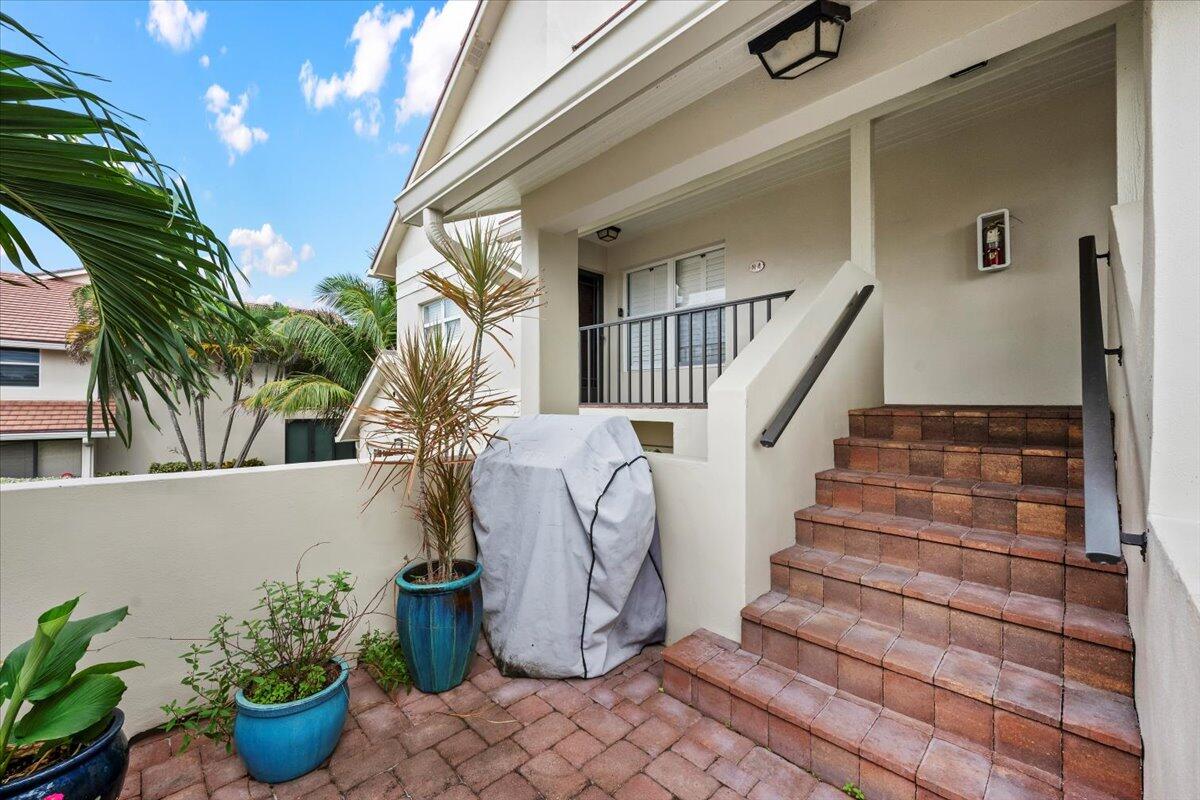 4161 U.S. Highway 1, Unit N3 Jupiter, FL 33477 - Photo 28 of 43 a view of entryway with wooden floor and stairs