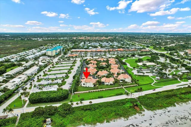 an aerial view of a houses with outdoor space and street view