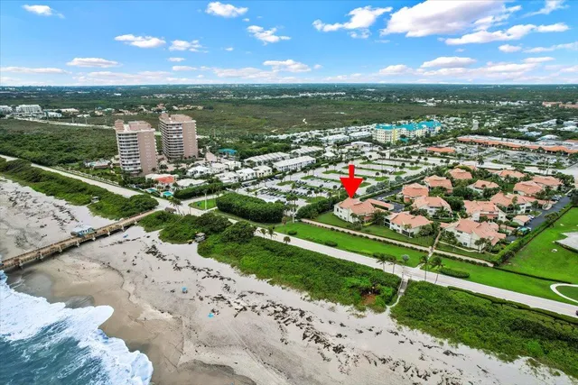 a view of a house with a yard and garage