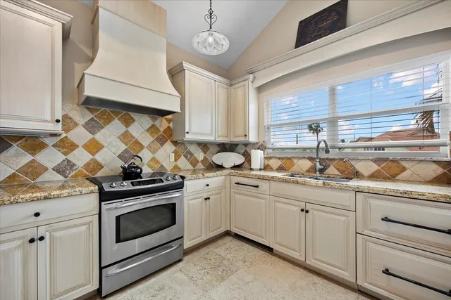 a kitchen with appliances cabinets and a sink