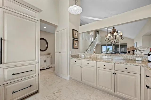 a spacious bathroom with double sink and a mirror