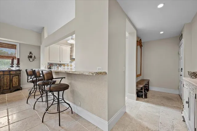 a view of a kitchen and dining room