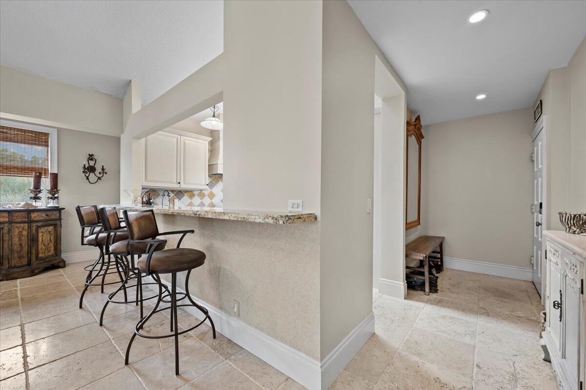 4161 U.S. Highway 1, Unit N3 Jupiter, FL 33477 - Photo 8 of 43 a view of a kitchen and dining room