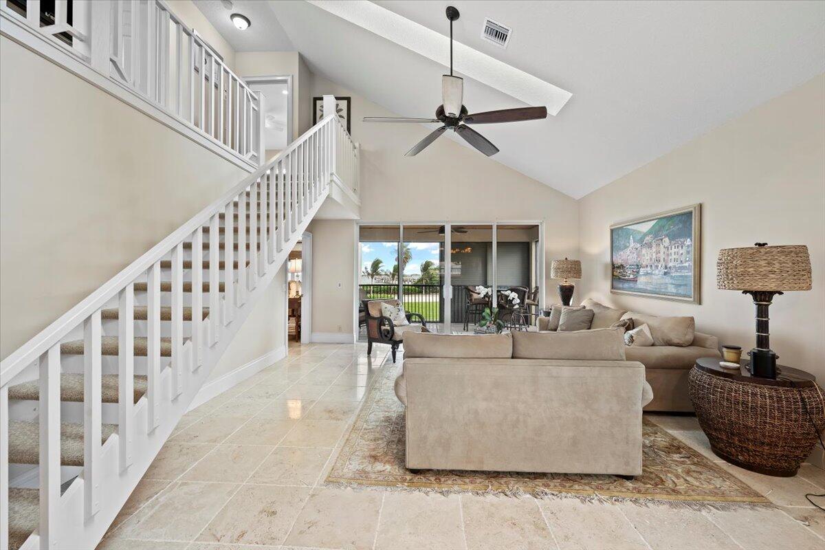 4161 U.S. Highway 1, Unit N3 Jupiter, FL 33477 - Photo 10 of 43 a living room with furniture and a chandelier