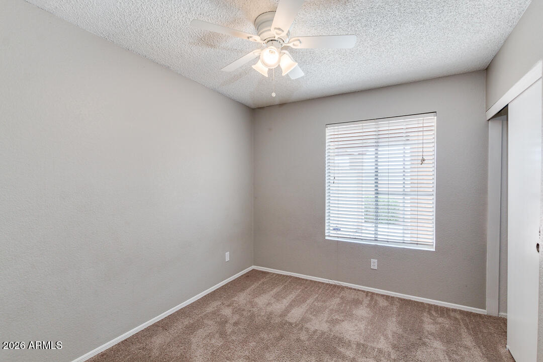 2145 East Center Lane, Unit 2 Tempe, AZ 85281 - Photo 11 of 20 a view of an empty room with a window