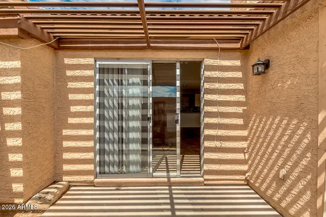 a view of a door and a window