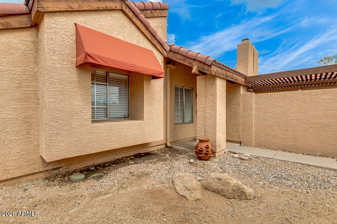 2145 East Center Lane, Unit 2 Tempe, AZ 85281 - Photo 14 of 20 a front view of a house with a yard