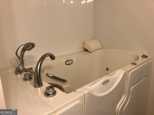 a bathroom with a tub and sink