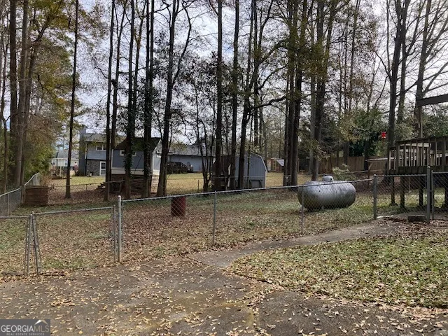 a backyard of a house with lots of green space