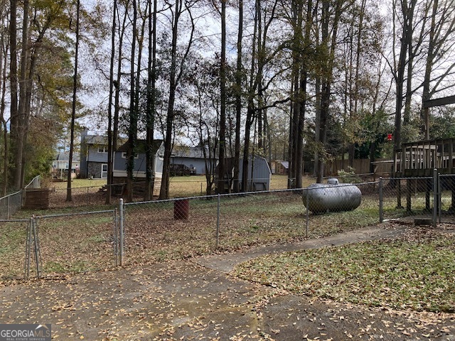 104 Dungeness Road Griffin, GA 30224 - Photo 15 of 36 a backyard of a house with lots of green space