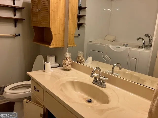 a bathroom with a sink and a toilet