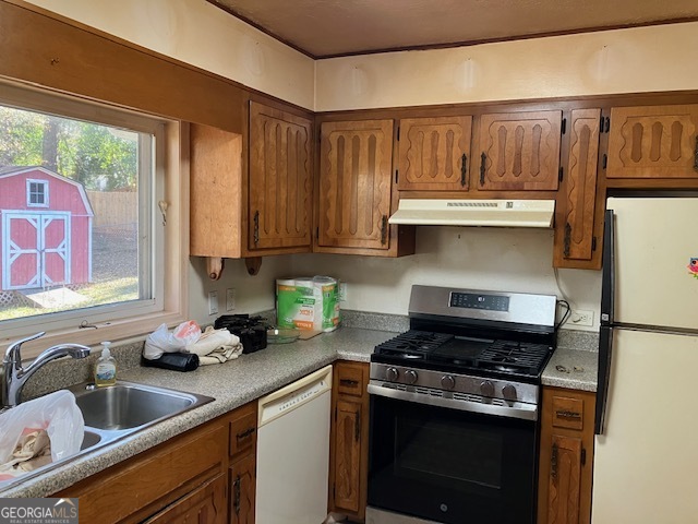 104 Dungeness Road Griffin, GA 30224 - Photo 31 of 36 a kitchen with stainless steel appliances granite countertop a sink stove and cabinets