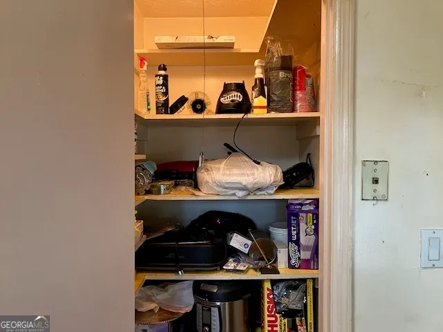 a room with lots of different colored cloths