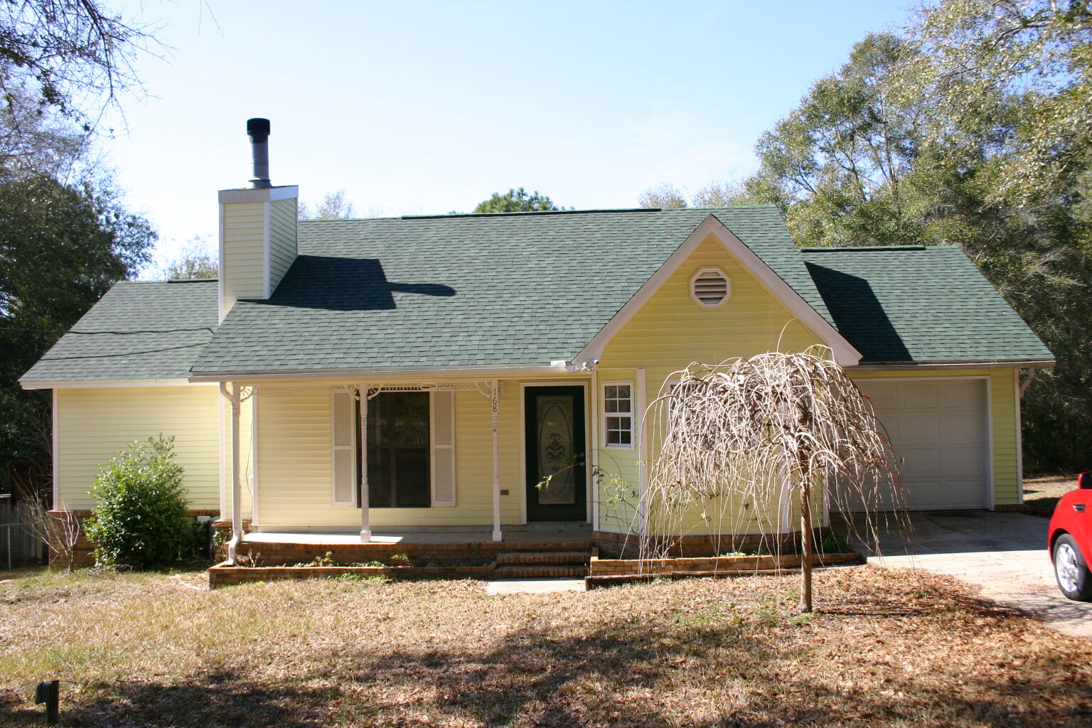 a front view of a house with garden