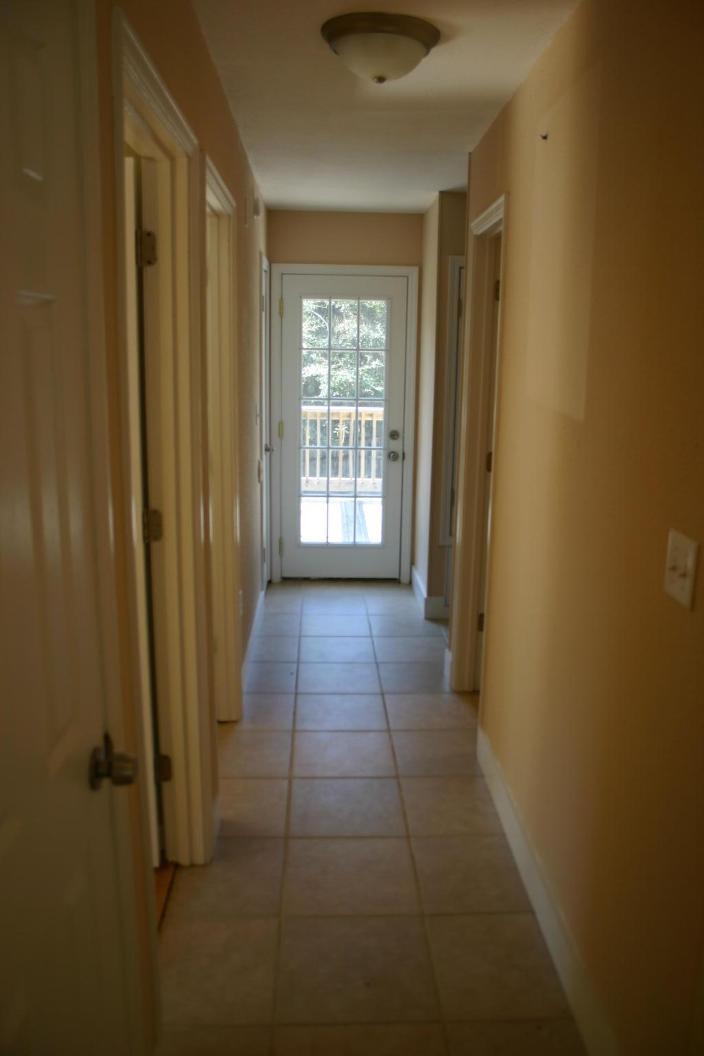 168 Ridge Lake Road Crestview, FL 32536 - Photo 15 of 28 a view of a hallway with windows