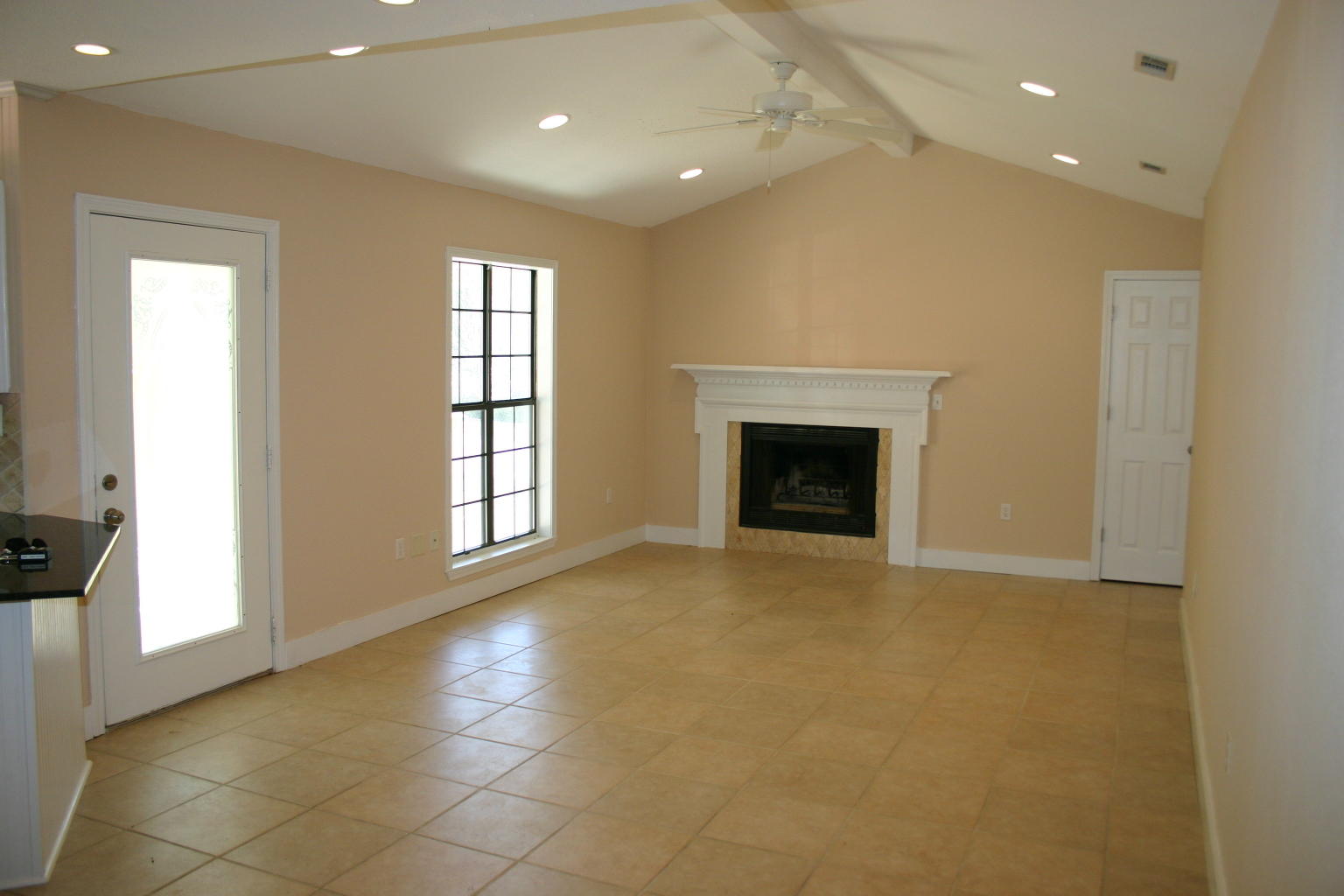 168 Ridge Lake Road Crestview, FL 32536 - Photo 2 of 28 a view of an empty room with a fireplace and a window