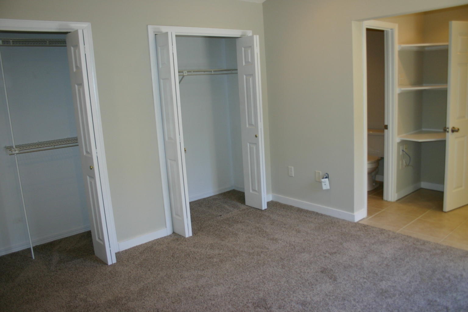 168 Ridge Lake Road Crestview, FL 32536 - Photo 22 of 28 a view of an empty room with closet and wooden floor
