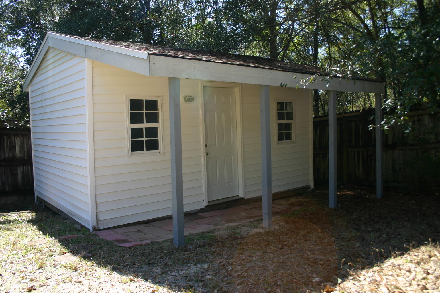 168 Ridge Lake Road Crestview, FL 32536 - Photo 28 of 28 a view of a small house with backyard and garden