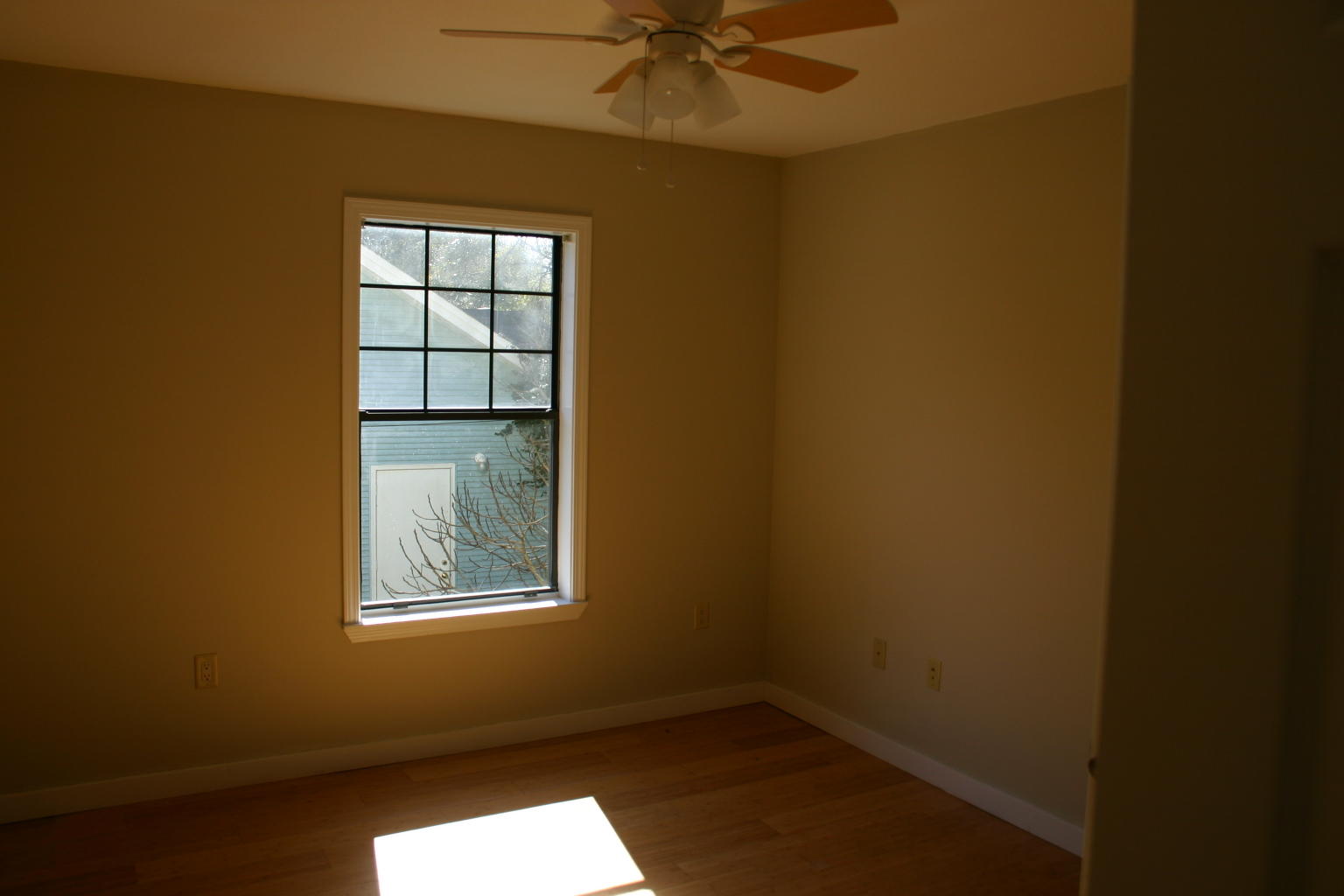168 Ridge Lake Road Crestview, FL 32536 - Photo 7 of 28 an empty room with windows and fan