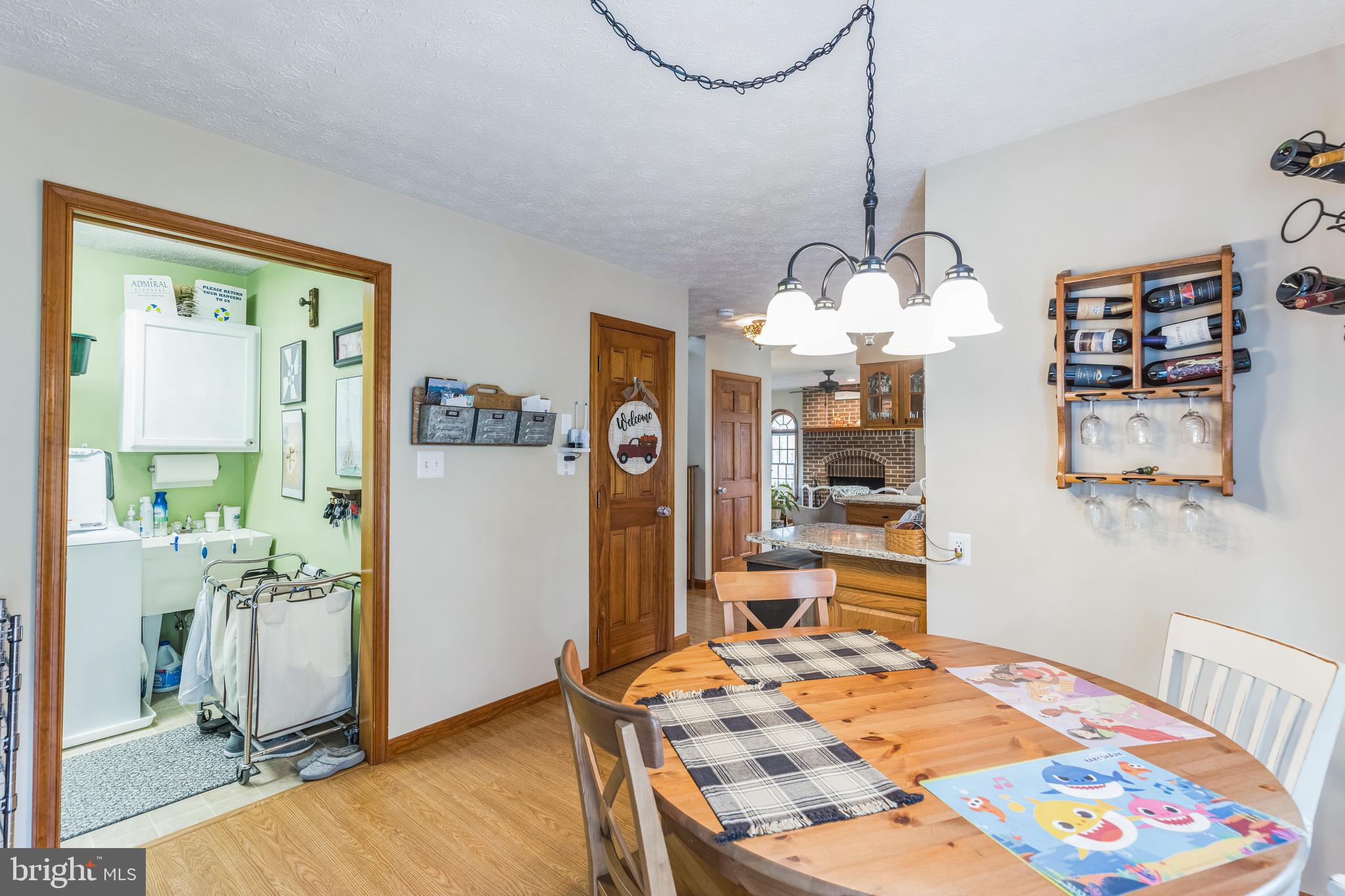 2734 Old Fort Schoolhouse Road Westminster, MD 21157 - Photo 11 of 44 a bedroom with a bed and a chandelier
