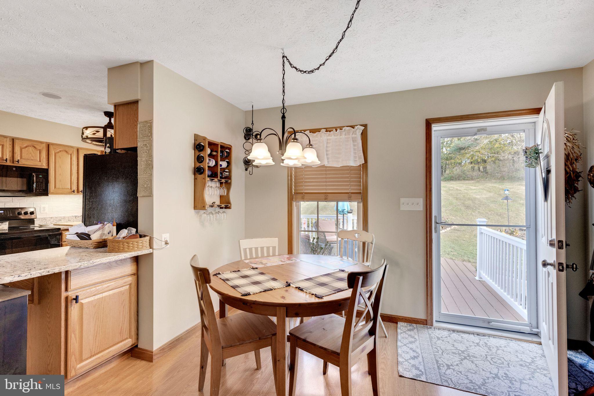 2734 Old Fort Schoolhouse Road Westminster, MD 21157 - Photo 13 of 44 a dining room with furniture a chandelier and window