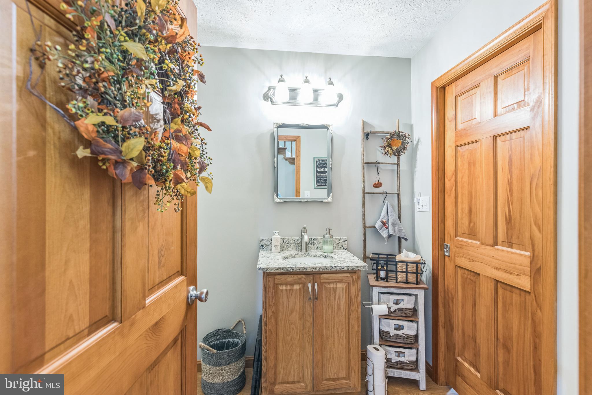 2734 Old Fort Schoolhouse Road Westminster, MD 21157 - Photo 15 of 44 a bathroom with a sink and a mirror