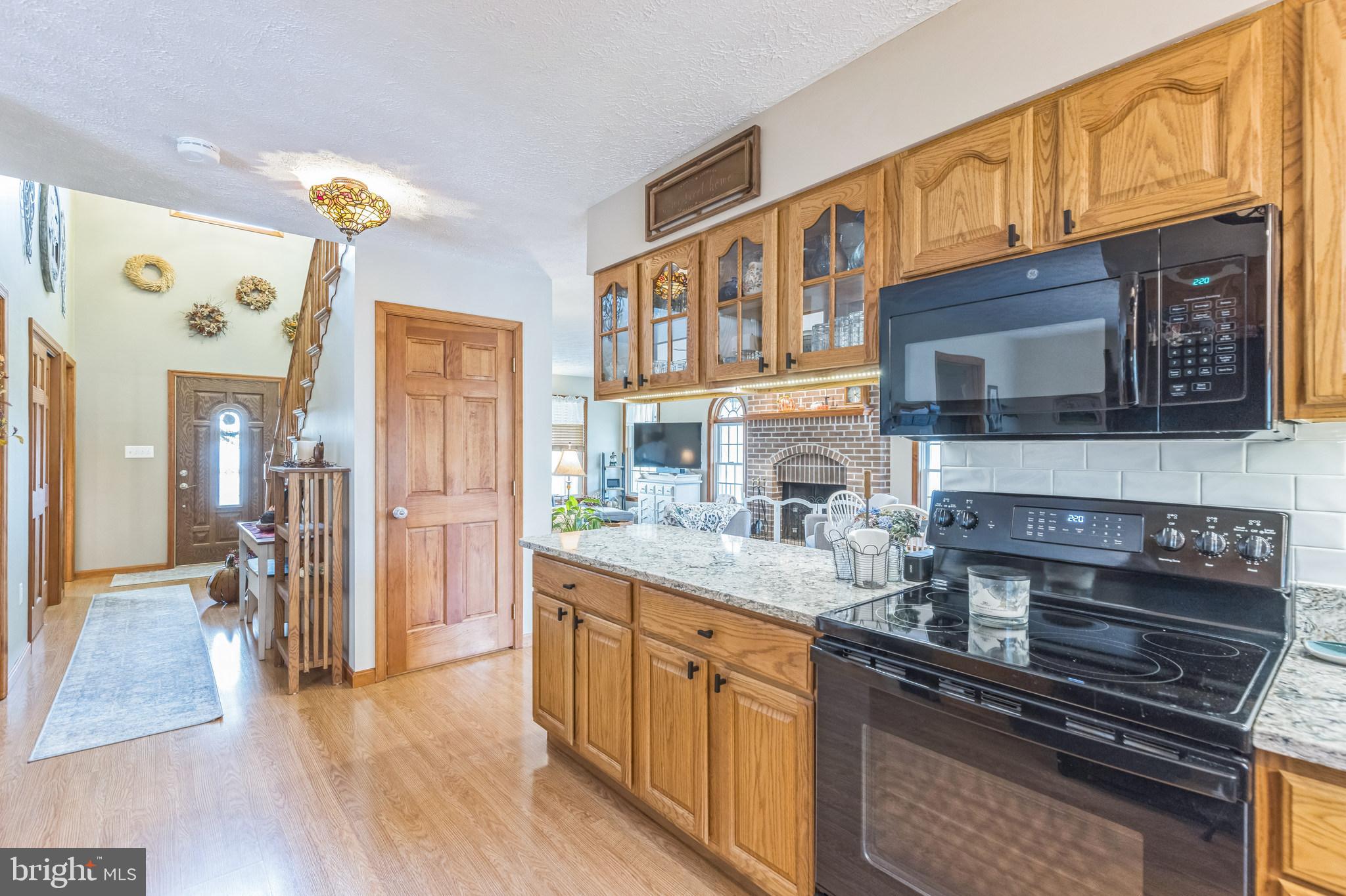 2734 Old Fort Schoolhouse Road Westminster, MD 21157 - Photo 18 of 44 a kitchen with stainless steel appliances granite countertop a stove and cabinets