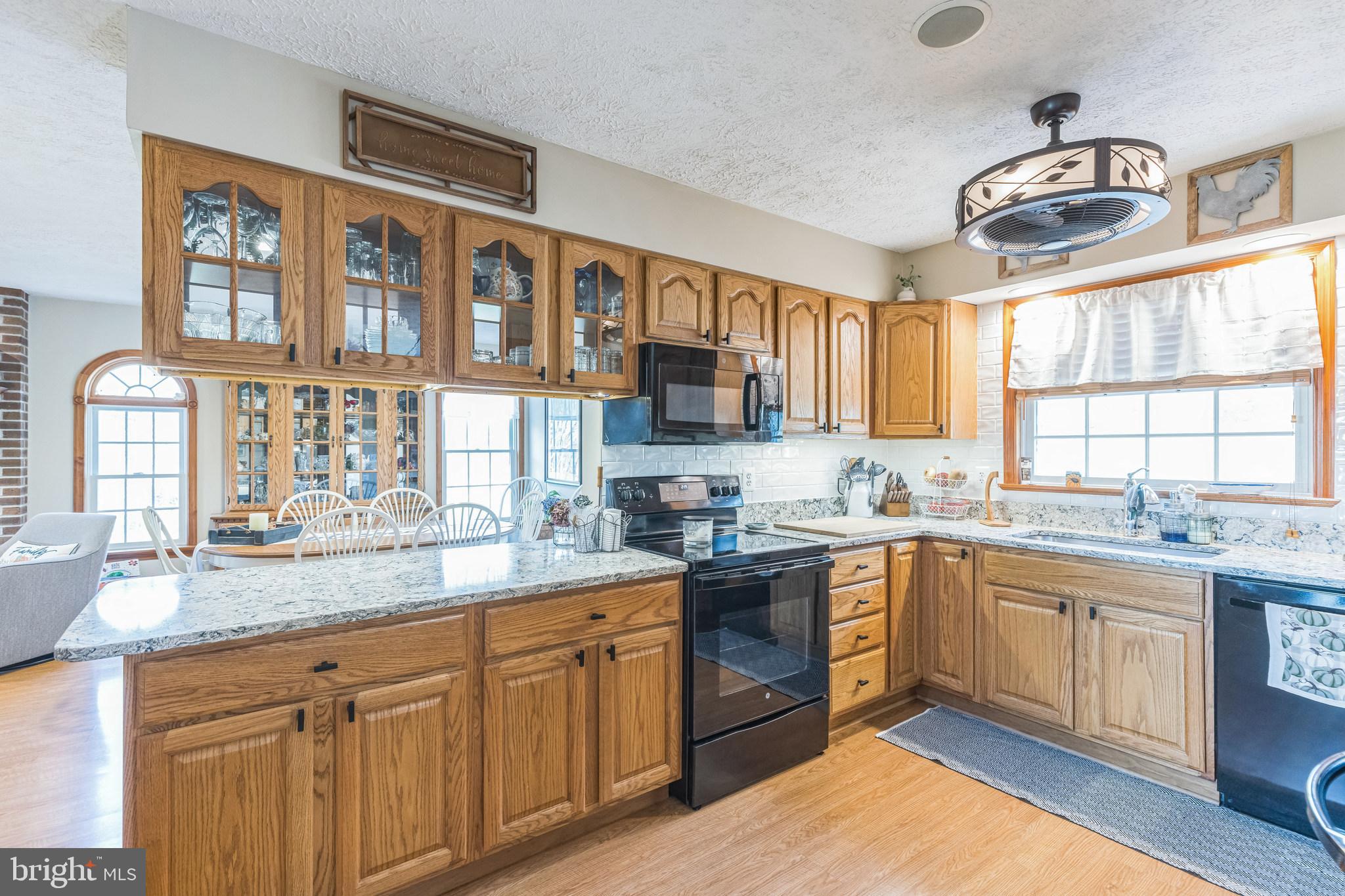 2734 Old Fort Schoolhouse Road Westminster, MD 21157 - Photo 19 of 44 a kitchen with a sink cabinets and window