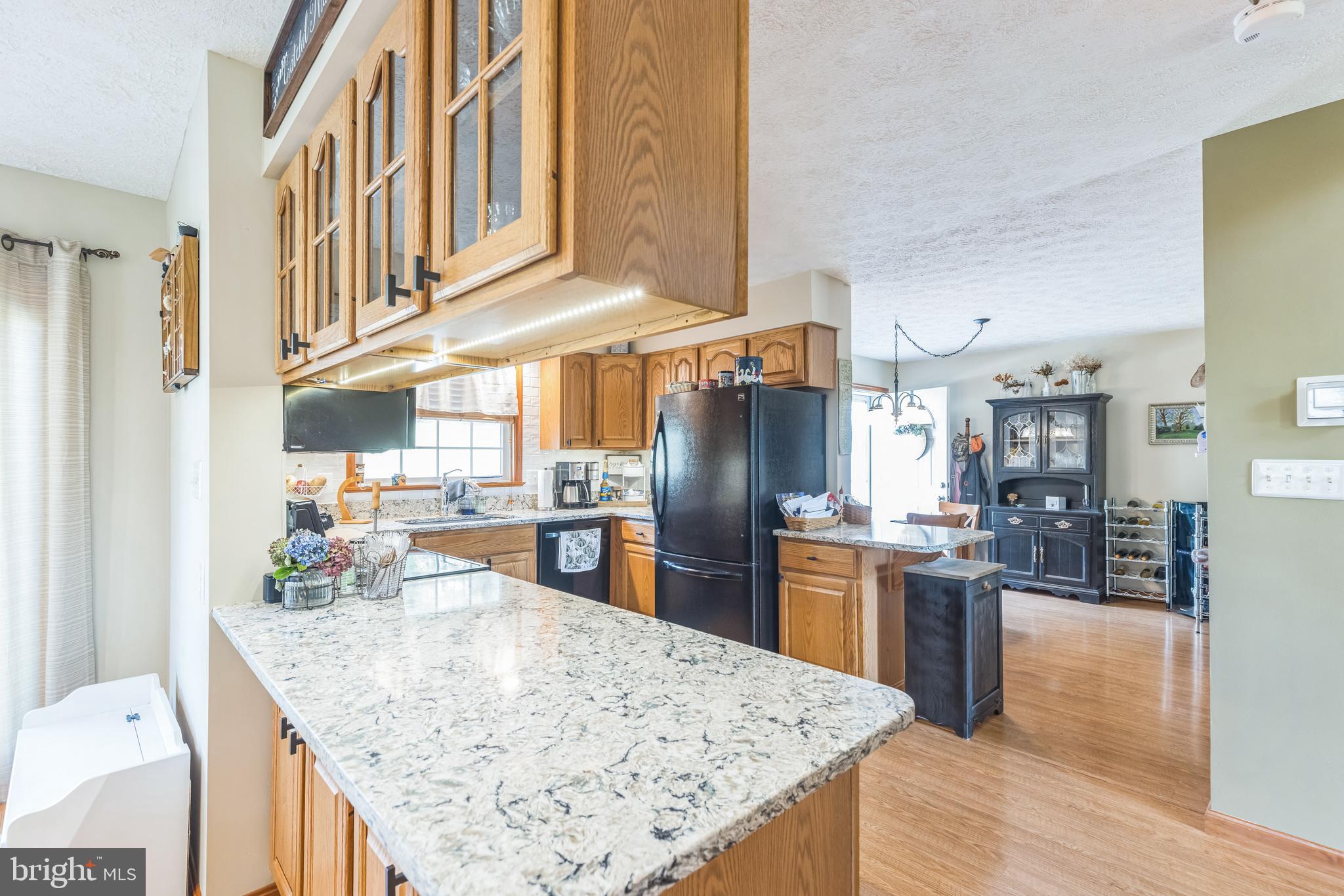 2734 Old Fort Schoolhouse Road Westminster, MD 21157 - Photo 20 of 44 a kitchen with stainless steel appliances granite countertop a sink refrigerator and cabinets