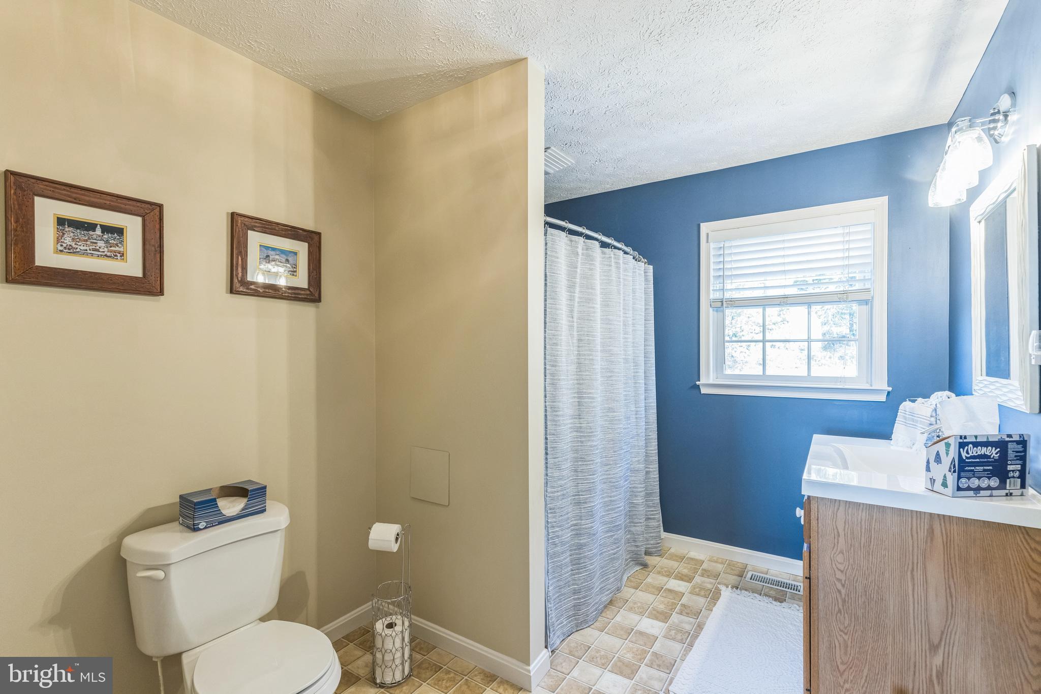 2734 Old Fort Schoolhouse Road Westminster, MD 21157 - Photo 23 of 44 a bathroom with a toilet sink and mirror