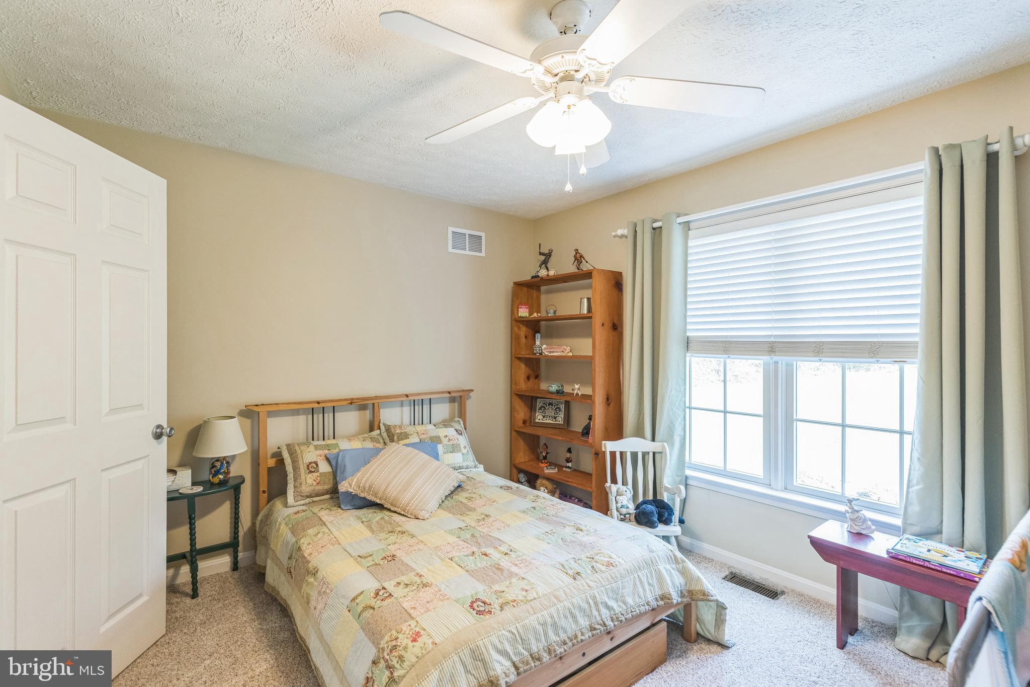 2734 Old Fort Schoolhouse Road Westminster, MD 21157 - Photo 27 of 44 a bedroom with a large bed and a window