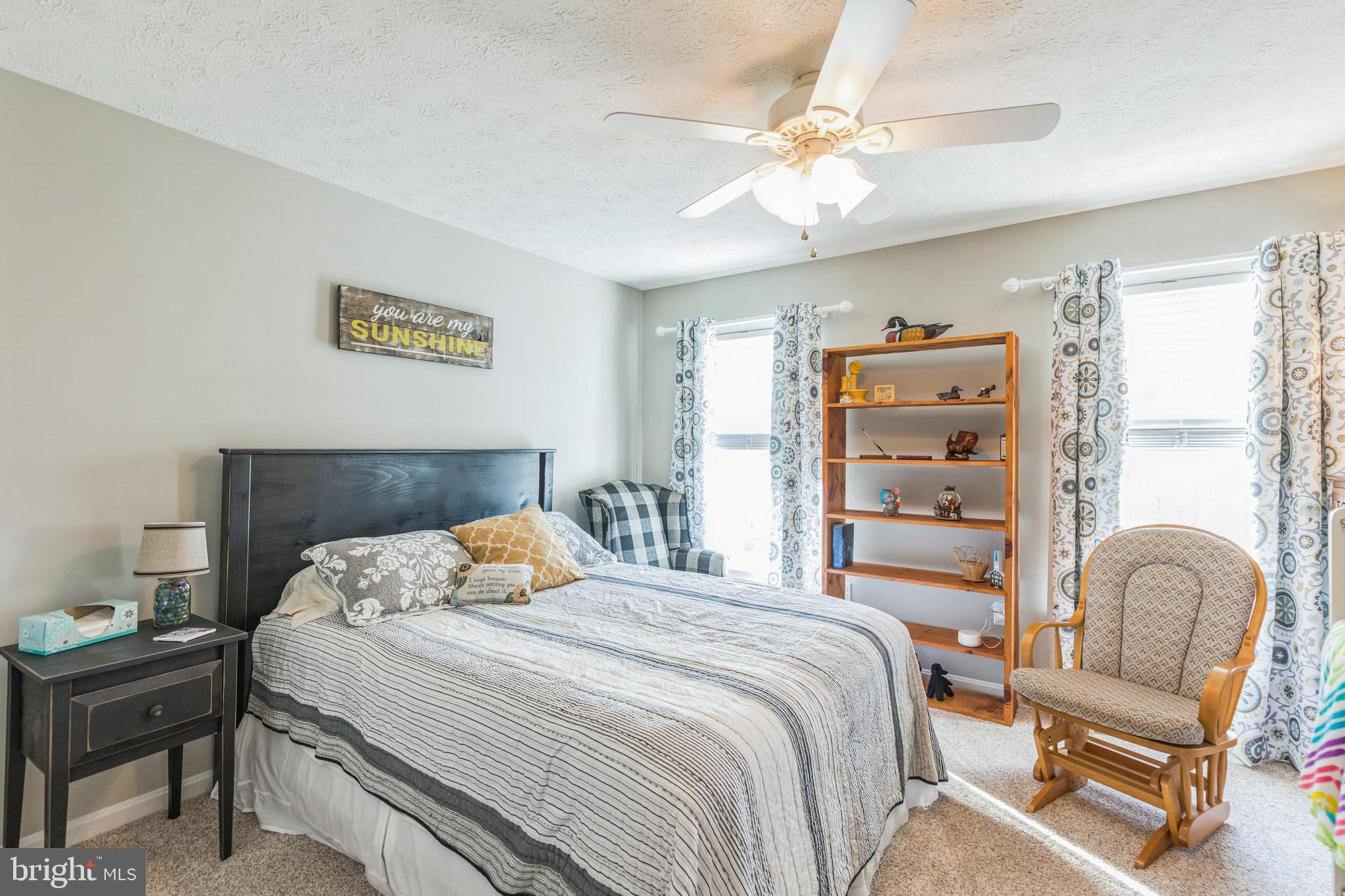2734 Old Fort Schoolhouse Road Westminster, MD 21157 - Photo 29 of 44 a bedroom with a bed and a chair
