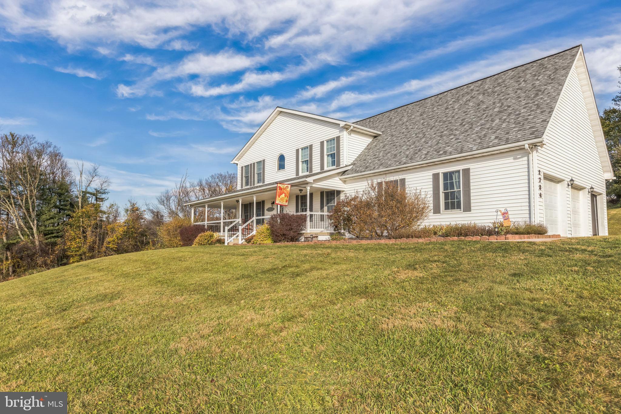 2734 Old Fort Schoolhouse Road Westminster, MD 21157 - Photo 3 of 44 a front view of a house with a garden