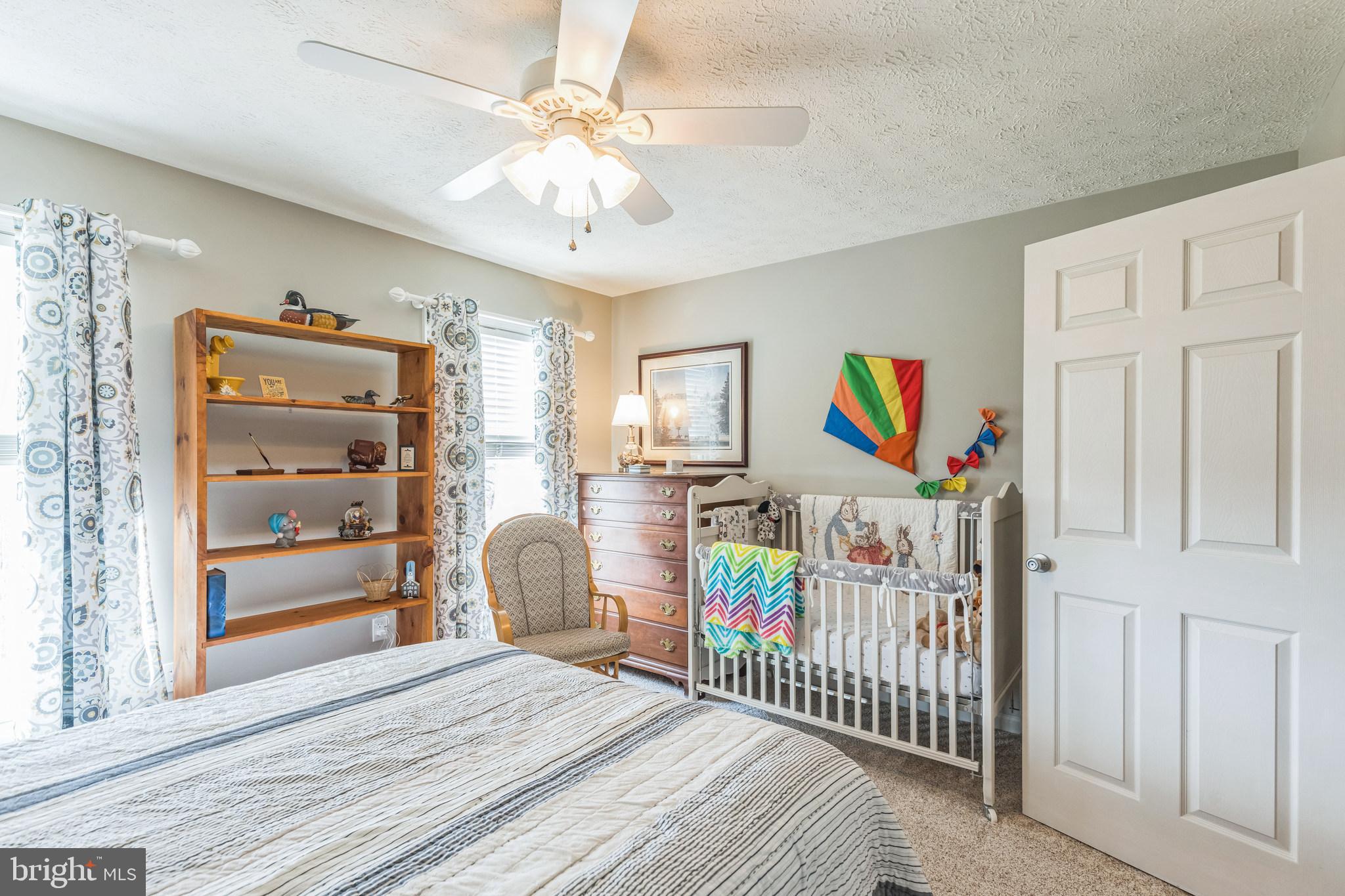 2734 Old Fort Schoolhouse Road Westminster, MD 21157 - Photo 32 of 44 a bedroom with furniture and baby crib