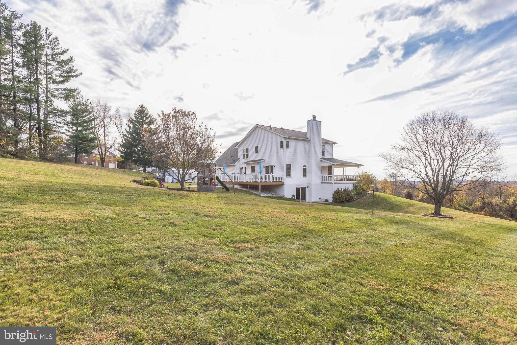 2734 Old Fort Schoolhouse Road Westminster, MD 21157 - Photo 37 of 44 a view of a large building with a big yard
