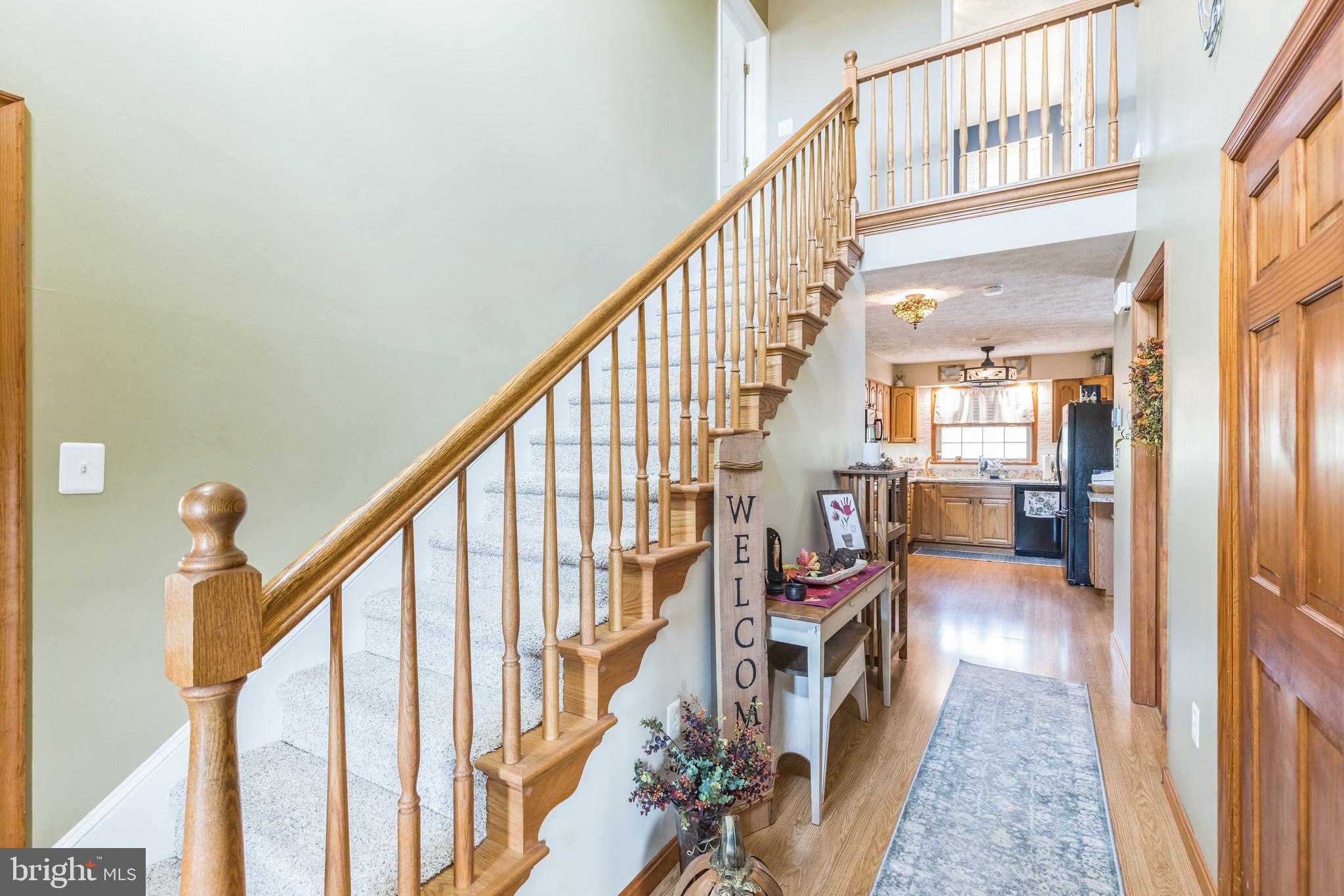 2734 Old Fort Schoolhouse Road Westminster, MD 21157 - Photo 4 of 44 a view of an entryway with wooden floor and stairs