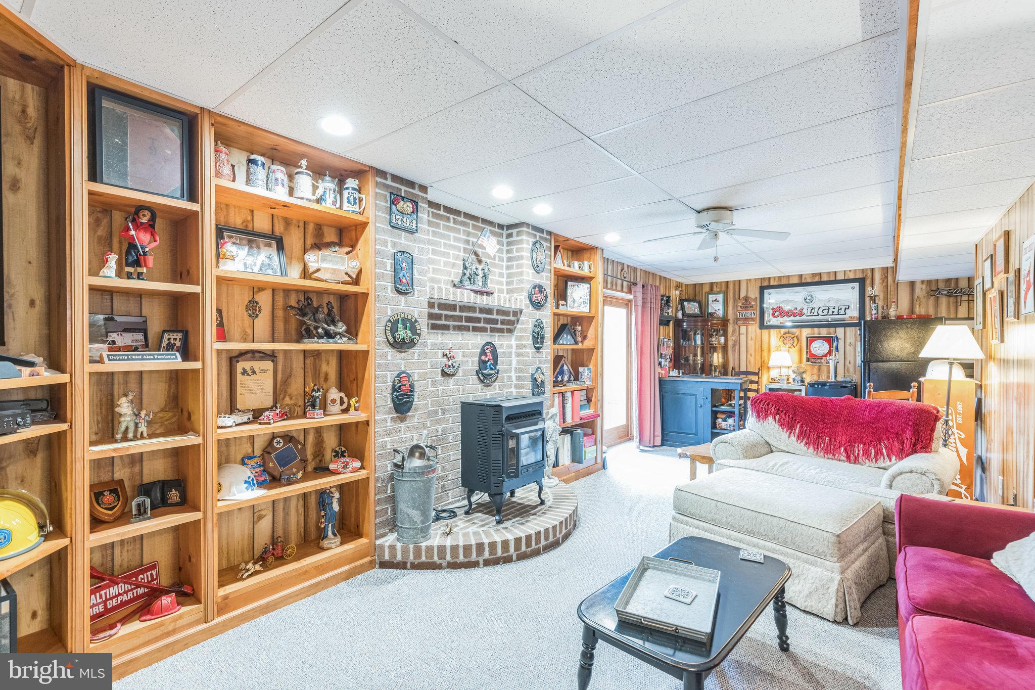 2734 Old Fort Schoolhouse Road Westminster, MD 21157 - Photo 41 of 44 a living room with furniture cabinets and a book shelf