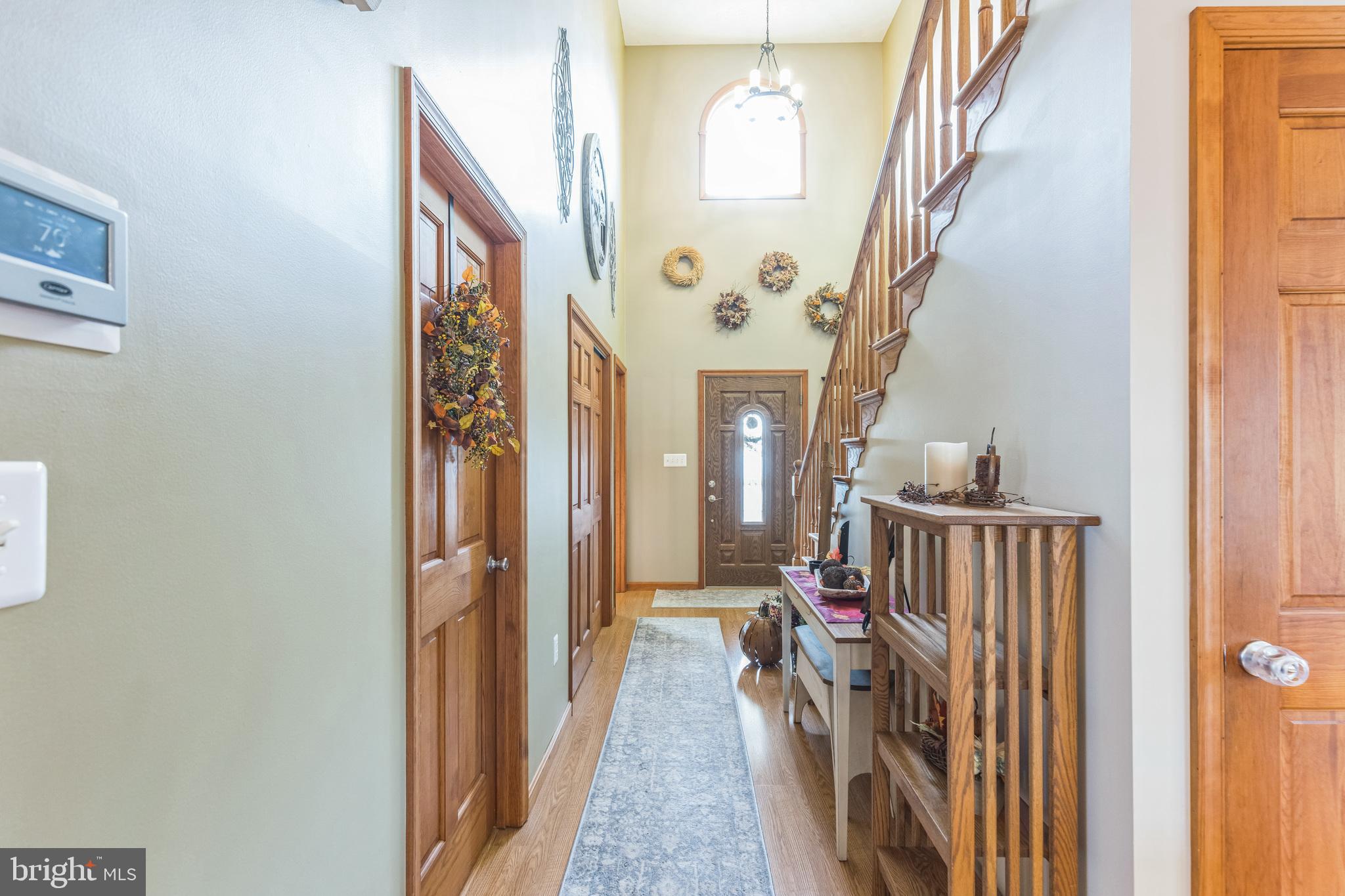 2734 Old Fort Schoolhouse Road Westminster, MD 21157 - Photo 5 of 44 a view of hallway with wooden floor and stairs