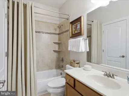 a bedroom with a bed furniture and a window