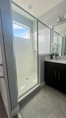 a bathroom with a bathtub a sink and a mirror