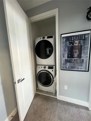 a view of a hallway with washer and dryer