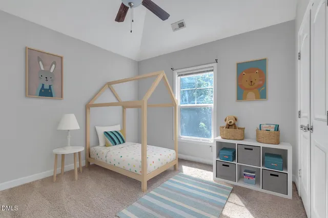 a bedroom with furniture and a window