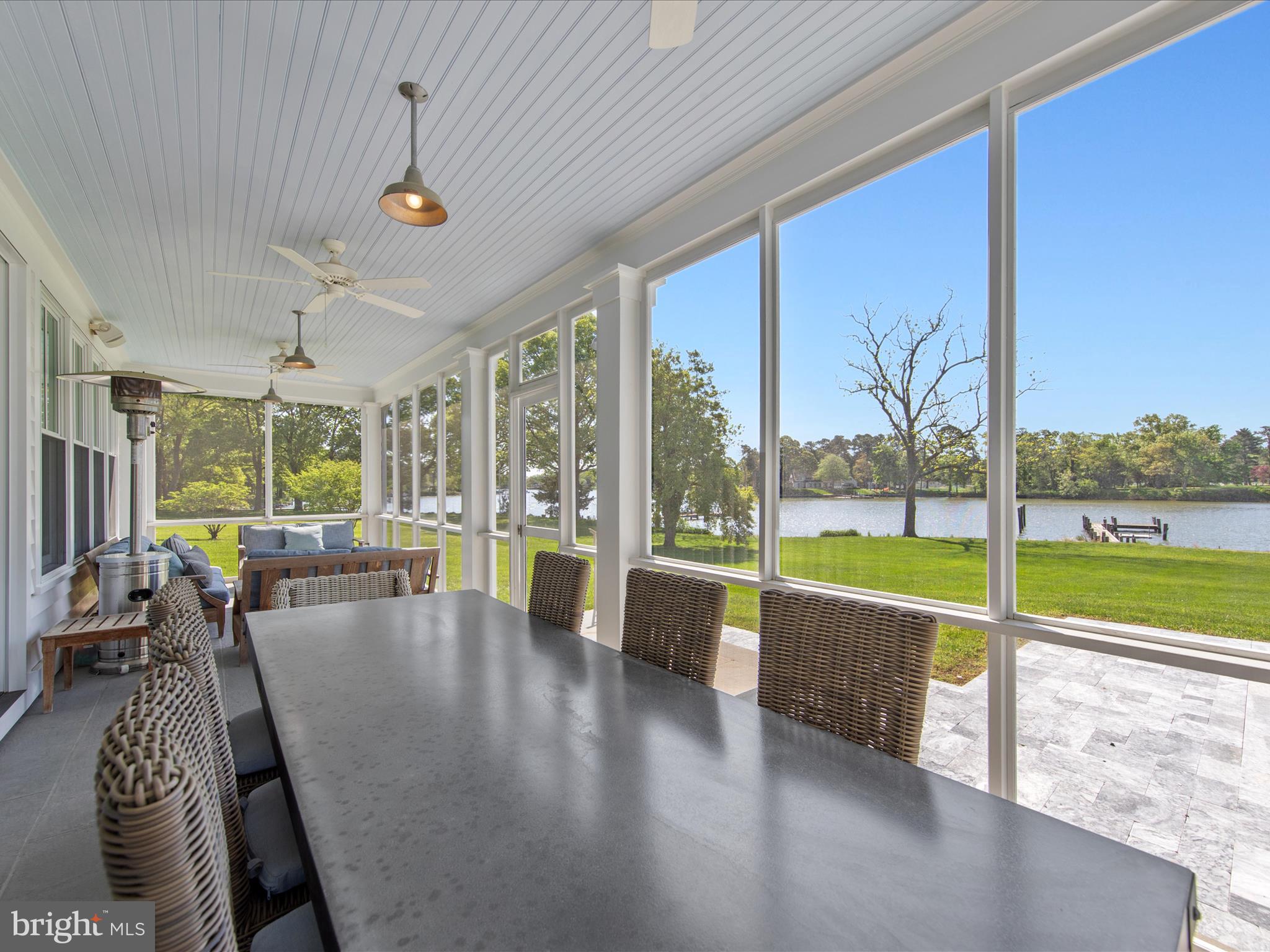 27753 Villa Road Easton, MD 21601 - Photo 13 of 46 Screened porch leads out to pool area