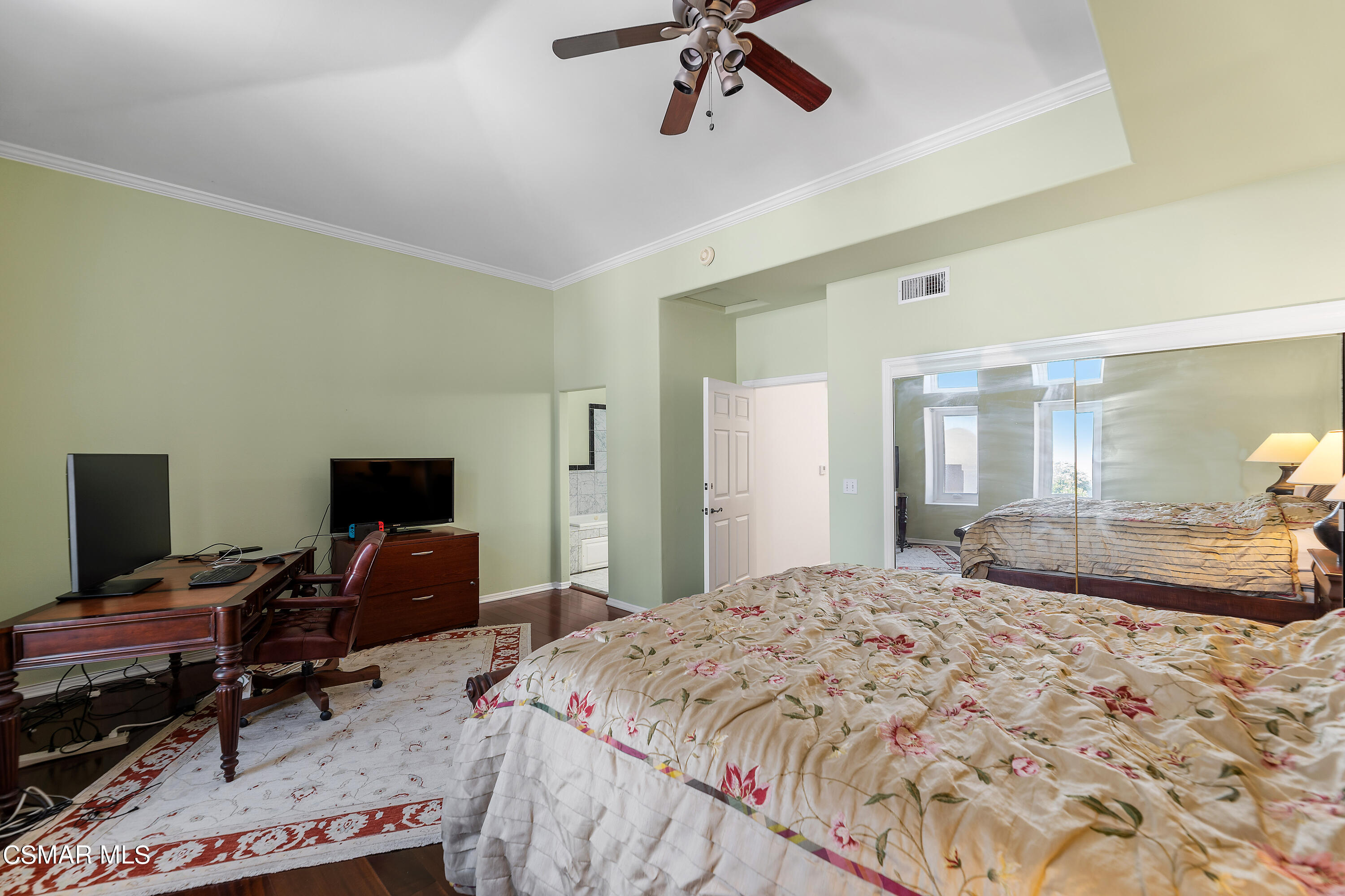 6435 Zumirez Drive, Unit 15 Malibu, CA 90265 - Photo 17 of 38 a bedroom with a bed and a desk