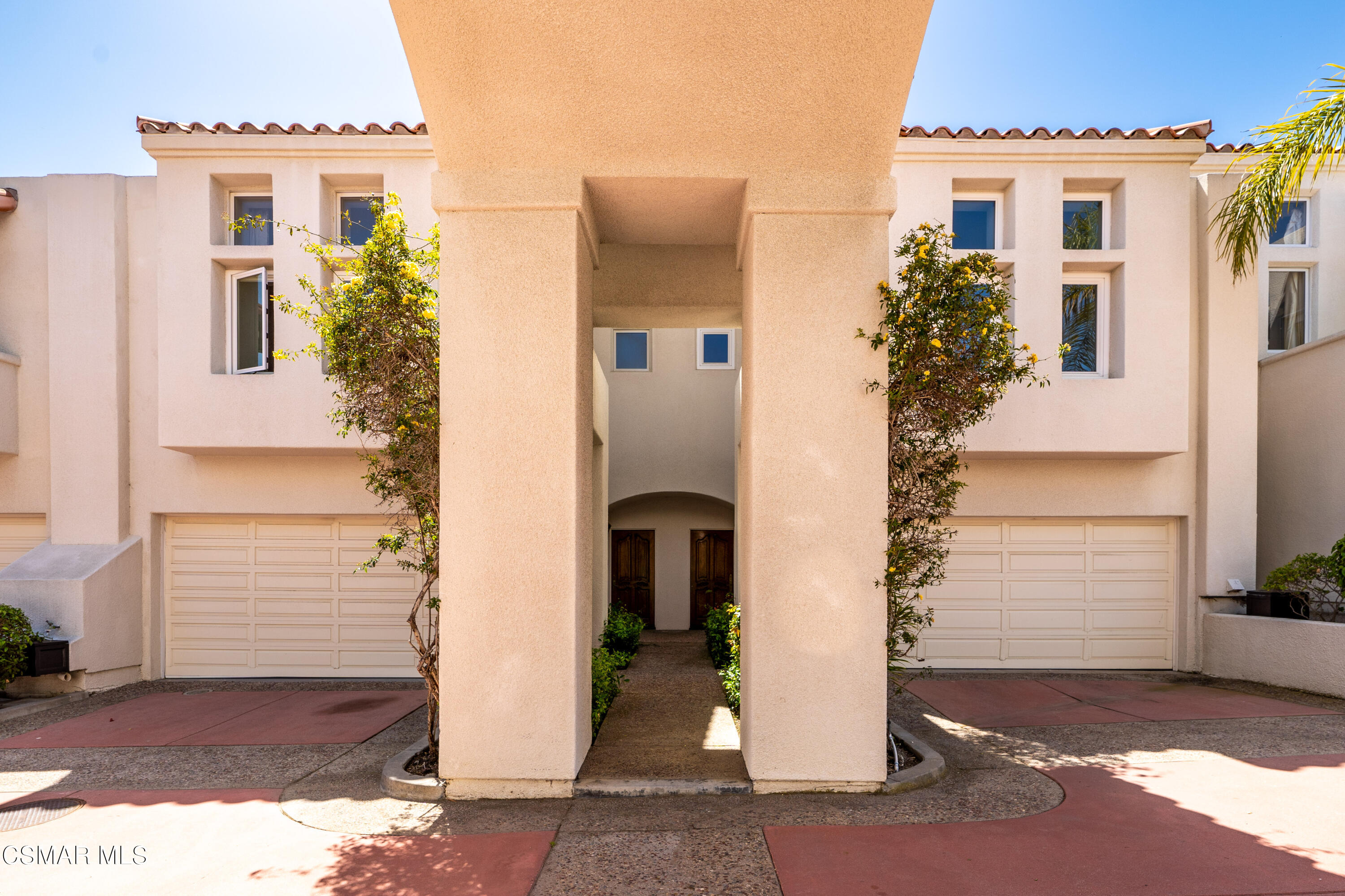 6435 Zumirez Drive, Unit 15 Malibu, CA 90265 - Photo 2 of 38 a front view of a house with a yard