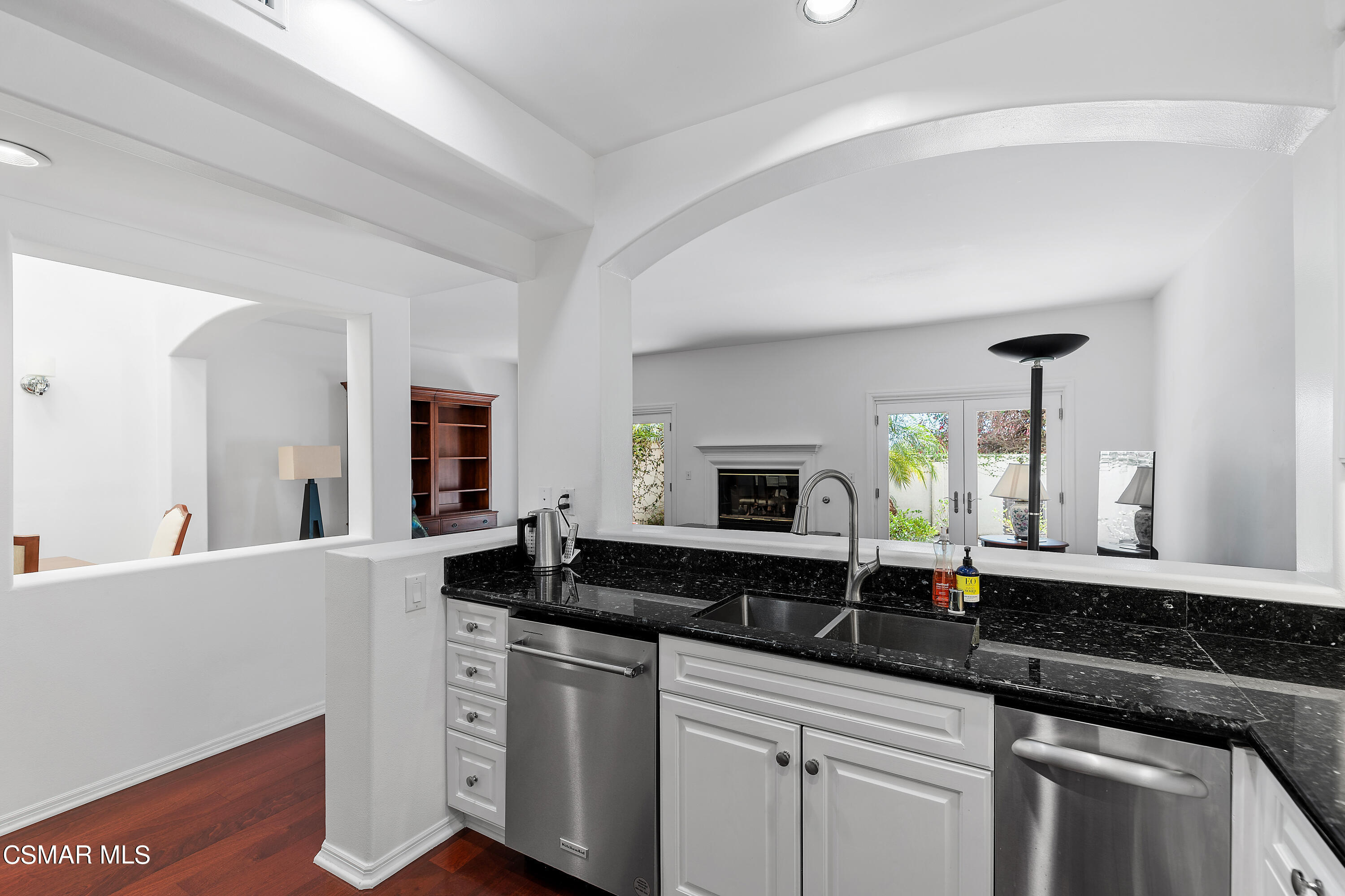 6435 Zumirez Drive, Unit 15 Malibu, CA 90265 - Photo 6 of 38 a kitchen with granite countertop a sink and cabinets